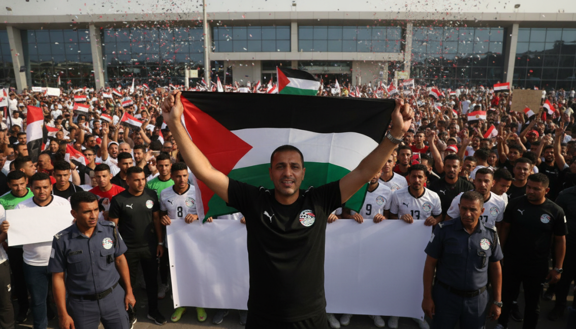 Egypt national team returns home to hero's welcome as coach waves Palestinian flag